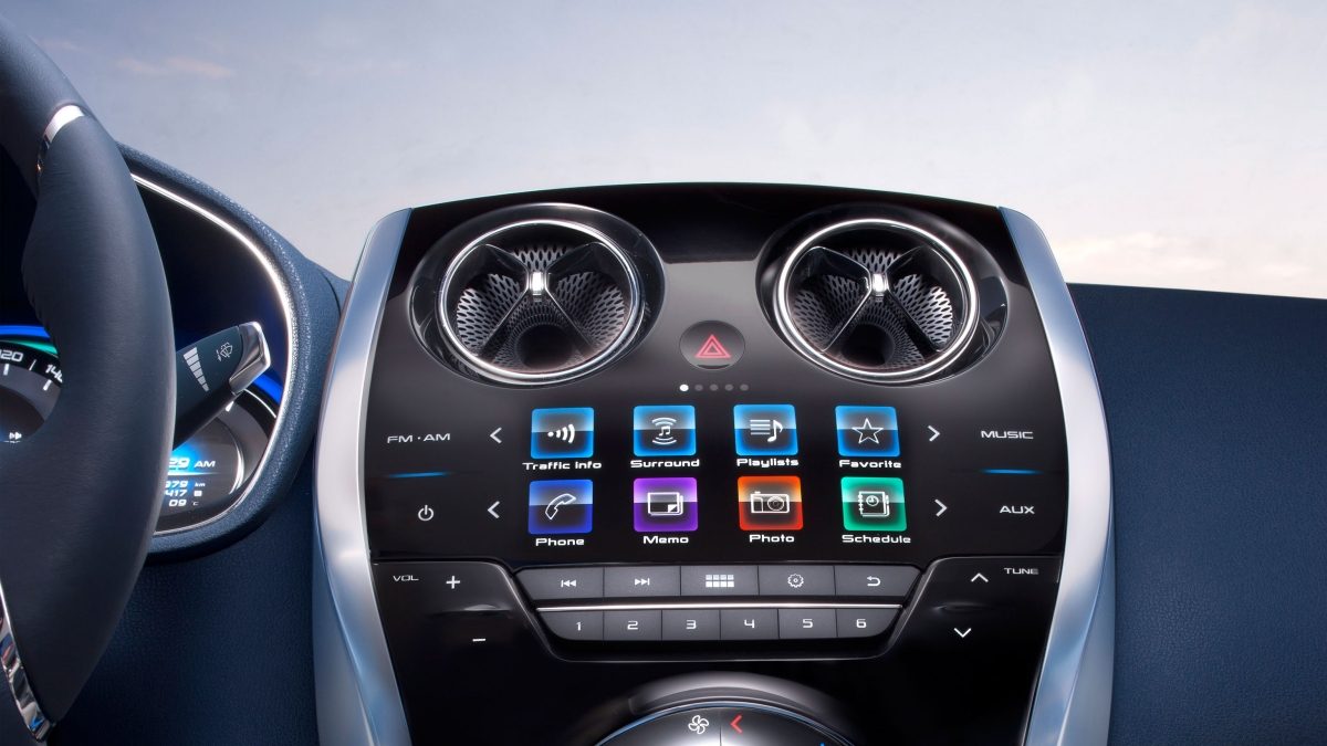 Close-up view of the Nissan Invitation infotainment controls on dashboard