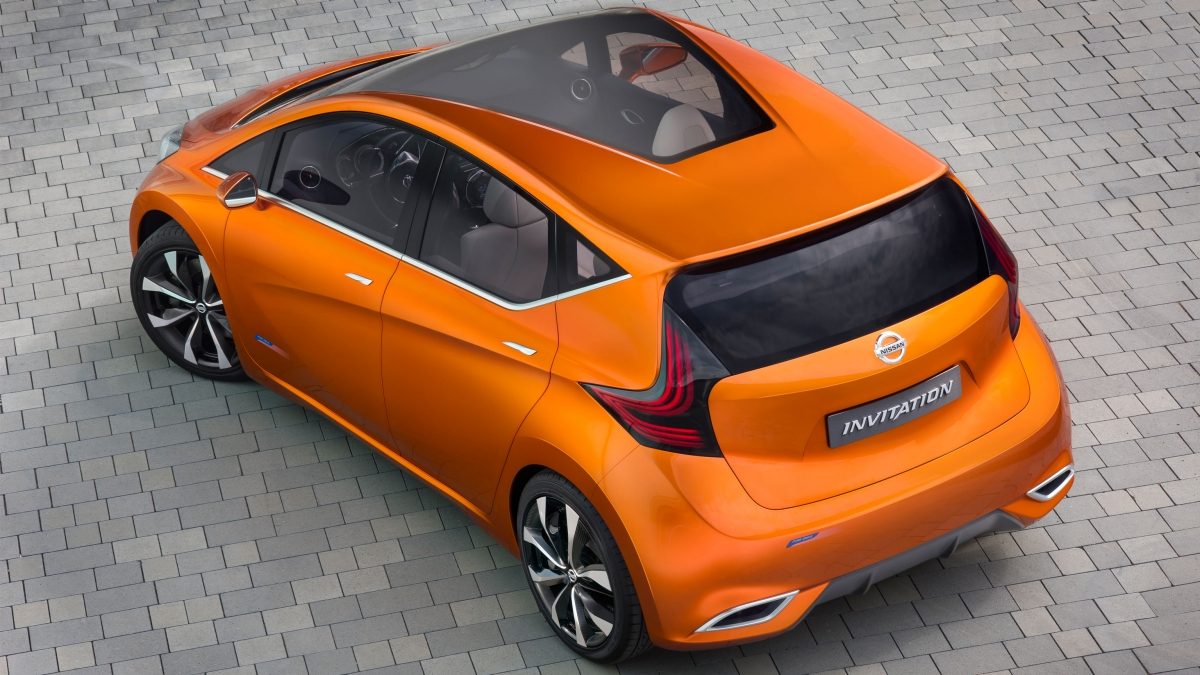 Rear overhead view of a Nissan Invitation shown in a shiny burnt orange color