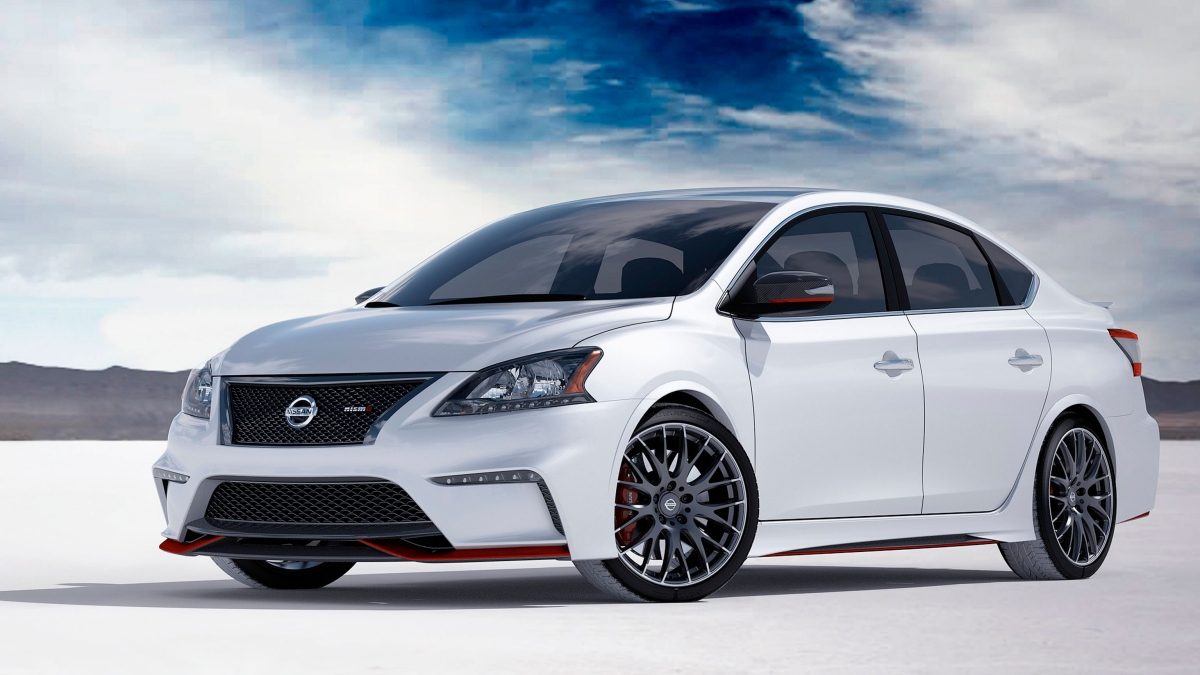 Front view of a silver Nissan Sentra® NISMO® concept car with red accents shown parked at an angle.
