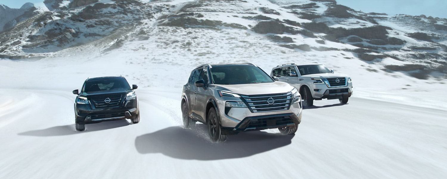 Nissan SUVs driving in snow